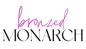 A logo-style graphic on a white background with the word 'bronzed' in purple script above the word 'MONARCH' in large black serif letters.